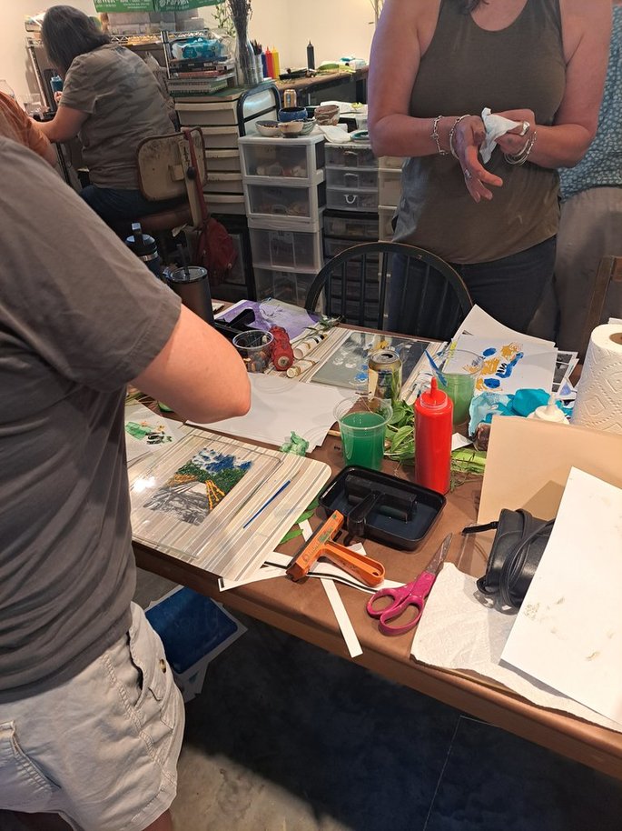 students in Tilley Bubb's studio working on gel plate prints'